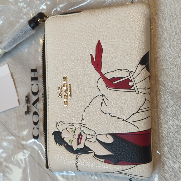 Coach Handbags - NWT Coach x Disney Cruella wristlet 😍